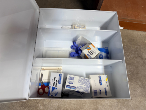 WALL MOUNTED FIRST AID KIT.