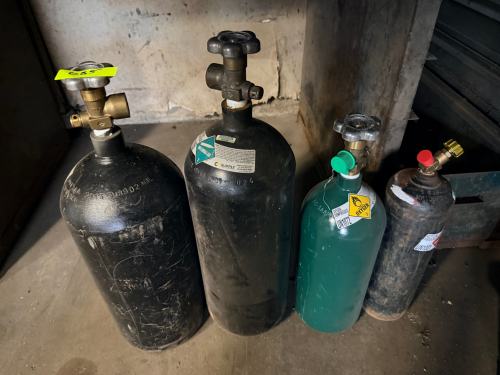 (4) ASSORTED CYLINDER TANKS ( SMALLER )