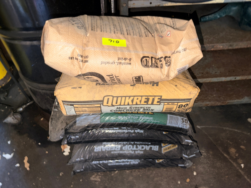 (1) BAG OF SAND, (1) BAG OF QUIKRETE, AND (4) BAGS OF BLACK TOP REPAIR