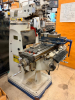 ACRA VARIABLE SPEED VERTICAL MILLING MACHINE WITH SWIVEL RAM, POWER FEED TABLE, DIGITAL READOUT, AND MACHINE VISE. MACHINE FEATURES A MEEHANITE CASTING CONSTRUCTION, VARIABLE SPEED HEAD WITH RPM DISPLAY, QUILL FEED, T-SLOTTED TABLE, AND INSTALLED NEWALL T - 2