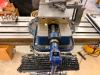 ACRA VARIABLE SPEED VERTICAL MILLING MACHINE WITH SWIVEL RAM, POWER FEED TABLE, DIGITAL READOUT, AND MACHINE VISE. MACHINE FEATURES A MEEHANITE CASTING CONSTRUCTION, VARIABLE SPEED HEAD WITH RPM DISPLAY, QUILL FEED, T-SLOTTED TABLE, AND INSTALLED NEWALL T - 10