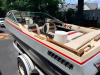 BARETTA BOWRIDER BOAT WITH WALK-THROUGH WINDSHIELD, OPEN COCKPIT SEATING, SWIM PLATFORM, REAR BOARDING LADDER, AND SINGLE STERN DRIVE. INCLUDES MATCHING ROLCO SINGLE-AXLE TRAILER. BOAT SHOWS WEATHERING, DUST ACCUMULATION, AGING INTERIOR UPHOLSTERY, AND SU - 14