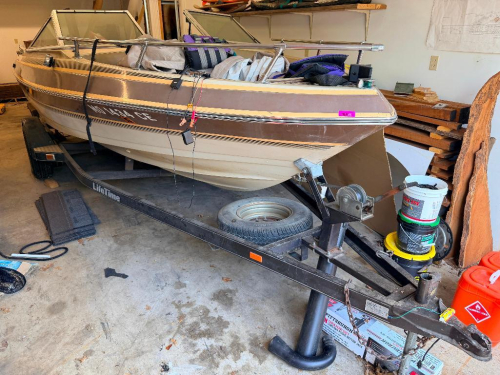 1986 BARETTA MH-191-RI BOWRIDER BOAT WITH MERCURY STERN DRIVE AND LIFETIME SINGLE-AXLE TRAILER. FIBERGLASS HULL WITH WALK-THROUGH WINDSHIELD, OPEN BOW SEATING, SWIM PLATFORM, SWIM LADDER, COCKPIT SEATING, GAUGES, MARINE RADIO, AND BIMINI TOP FRAME. BOAT S