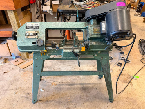 ENCO METAL CUTTING BAND SAW WITH HORIZONTAL AND VERTICAL CUTTING CAPABILITY, ADJUSTABLE VISE, VARIABLE BLADE SPEEDS, AND FACTORY METAL STAND.