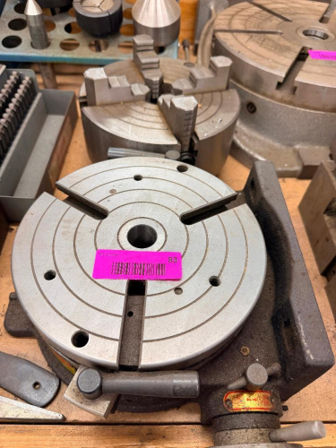 PRECISION ROTARY TABLE WITH DEGREE GRADUATIONS AND LOCKING HANDLE. INCLUDES MOUNTED 4-JAW INDEPENDENT CHUCK AS SHOWN. MANUFACTURED IN TAIWAN BY TZU YEN INDUSTRIAL CO.