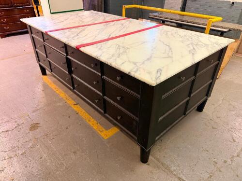 LARGE RECTANGULAR KITCHEN ISLAND/WORKTABLE FEATURING A POLISHED MARBLE TOP, DARK WOOD BASE CONSTRUCTION, MULTIPLE STORAGE DRAWERS ON ALL SIDES, AND A CENTER CABINET WITH PULL-OUT SHELF. FINISHED WITH DECORATIVE HARDWARE AND TAPERED LEGS.