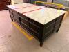 LARGE RECTANGULAR KITCHEN ISLAND/WORKTABLE FEATURING A POLISHED MARBLE TOP, DARK WOOD BASE CONSTRUCTION, MULTIPLE STORAGE DRAWERS ON ALL SIDES, AND A CENTER CABINET WITH PULL-OUT SHELF. FINISHED WITH DECORATIVE HARDWARE AND TAPERED LEGS.