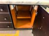 LARGE RECTANGULAR KITCHEN ISLAND/WORKTABLE FEATURING A POLISHED MARBLE TOP, DARK WOOD BASE CONSTRUCTION, MULTIPLE STORAGE DRAWERS ON ALL SIDES, AND A CENTER CABINET WITH PULL-OUT SHELF. FINISHED WITH DECORATIVE HARDWARE AND TAPERED LEGS. - 6