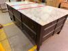 LARGE RECTANGULAR KITCHEN ISLAND/WORKTABLE FEATURING A POLISHED MARBLE TOP, DARK WOOD BASE CONSTRUCTION, MULTIPLE STORAGE DRAWERS ON ALL SIDES, AND A CENTER CABINET WITH PULL-OUT SHELF. FINISHED WITH DECORATIVE HARDWARE AND TAPERED LEGS. - 8