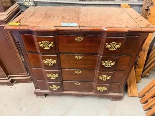 TRADITIONAL DROP-LEAF CHEST FEATURING A RECTANGULAR EXPANDABLE TOP, EIGHT SMALL SIDE DRAWERS, FOUR CENTER DRAWERS, AND DECORATIVE BRASS-TONE HARDWARE. CONSTRUCTED OF WOOD WITH A DARK STAINED FINISH AND MOLDED BASE.