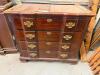 TRADITIONAL DROP-LEAF CHEST FEATURING A RECTANGULAR EXPANDABLE TOP, EIGHT SMALL SIDE DRAWERS, FOUR CENTER DRAWERS, AND DECORATIVE BRASS-TONE HARDWARE. CONSTRUCTED OF WOOD WITH A DARK STAINED FINISH AND MOLDED BASE. - 2