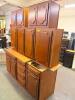 TRADITIONAL KITCHEN CABINET SET CONSISTING OF MULTIPLE WALL CABINETS, BASE CABINETS, DRAWER BASE UNITS, AND STORAGE CABINET SECTIONS. FEATURES DECORATIVE RAISED PANEL DOORS WITH ROUTED EDGE DETAILS AND A MEDIUM CHERRY STAIN FINISH.