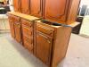 TRADITIONAL KITCHEN CABINET SET CONSISTING OF MULTIPLE WALL CABINETS, BASE CABINETS, DRAWER BASE UNITS, AND STORAGE CABINET SECTIONS. FEATURES DECORATIVE RAISED PANEL DOORS WITH ROUTED EDGE DETAILS AND A MEDIUM CHERRY STAIN FINISH. - 3