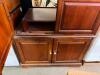 TELEVISION ENTERTAINMENT ARMOIRE WITH RAISED PANEL DOORS AND LOWER STORAGE CABINET IN A CHERRY FINISH. FEATURES FOUR FULL-HEIGHT CABINET DOORS WITH AN INTERIOR TELEVISION COMPARTMENT, ADJUSTABLE SHELVING, AND AN ENCLOSED LOWER STORAGE SECTION - 3