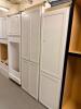 WHITE SHAKER-STYLE TALL PANTRY CABINET SET CONSISTING OF ONE DOUBLE-DOOR FULL-HEIGHT CABINET AND ONE SINGLE-DOOR FULL-HEIGHT CABINET. CABINETS FEATURE RECESSED PANEL DOORS WITH A PAINTED WHITE FINISH
