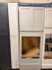 WHITE SHAKER-STYLE OVEN CABINET ASSEMBLY WITH OVERHEAD DOUBLE-DOOR STORAGE CABINET AND MATCHING FULL-HEIGHT FILLER PANEL. FEATURES A LARGE CENTER OPENING DESIGNED TO ACCEPT A BUILT-IN OVEN UNIT AND A PAINTED WHITE FINISH. - 2