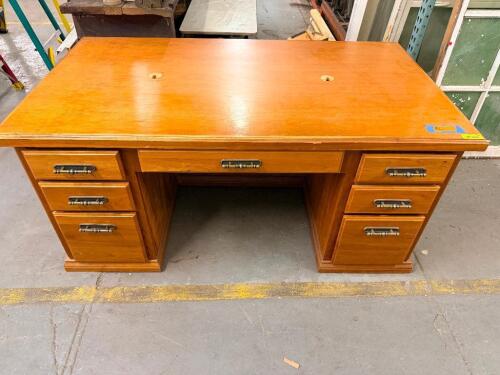 72" WOOD DOUBLE PEDESTAL EXECUTIVE DESK WITH A NATURAL WOOD FINISH, RECTANGULAR WORK SURFACE, SEVEN TOTAL DRAWERS, AND DECORATIVE METAL PULL HANDLES.