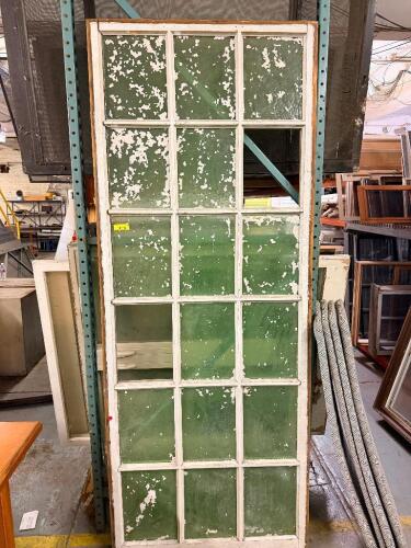 38" X 96" ANTIQUE WOOD MULTI-LITE WINDOW SASH WITH DIVIDED LIGHT DESIGN AND ORIGINAL DISTRESSED WHITE PAINT FINISH. WINDOW FEATURES MULTIPLE GLASS PANES WITH ONE MISSING PANE