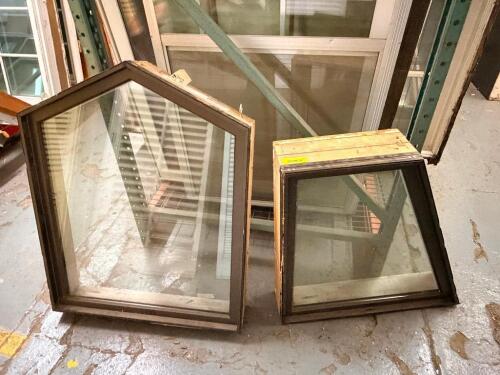 PAIR OF INSULATED FIXED ARCH-TOP WINDOW SASHES WITH BRONZE-COLORED EXTERIOR CLADDING. INCLUDES ONE PENTAGONAL UNIT AND ONE SMALL TRAPEZOIDAL UNIT