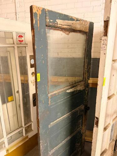 VINTAGE RECLAIMED HARDWOOD DOOR W/ GLASS INSERT PANELS.