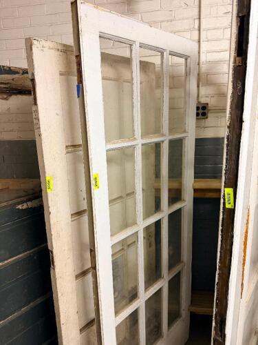 VINTAGE RECLAIMED HARDWOOD DOOR W/ GLASS INSERT PANELS.