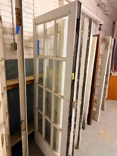 VINTAGE RECLAIMED HARDWOOD DOOR W/ GLASS INSERT PANELS.