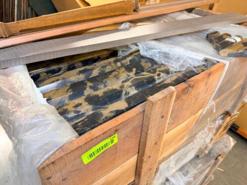 LOT OF POLISHED NATURAL STONE SLABS AND COUNTERTOP PIECES IN WOODED SHIPPING CRATES. LOT INCLUDES ASSORTED MARBLE AND GRANITE SECTIONS WITH POLISHED FINISHES IN VARIOUS COLORS, PATTERNS, AND DIMENSIONS.