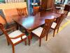 7-PIECE WOOD DINING SET INCLUDING EXTENSION TABLE, SIX CHAIRS (TWO ARMCHAIRS AND FOUR SIDE CHAIRS). FEATURES TURNED LEGS, SLAT-BACK CHAIRS, AND PADDED UPHOLSTERED SEATS.