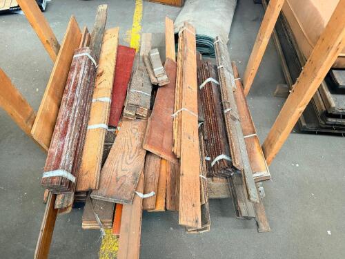 LOT OF RECLAIMED HARDWOOD TRIM, MOLDING, AND MILLWORK PIECES. LOT INCLUDES ASSORTED LENGTHS OF DECORATIVE TRIM, BASEBOARD, CASING, AND OTHER FINISHED WOOD MOLDING WITH VARIOUS PROFILES AND FINISHES.