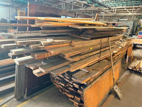 LOT OF RECLAIMED HEAVY TIMBERS AND STRUCTURAL LUMBER. LOT INCLUDES ASSORTED SOLID WOOD BEAMS, POSTS, AND DIMENSIONAL LUMBER IN VARIOUS LENGTHS AND CROSS SECTIONS SUITABLE FOR REUSE, TIMBER FRAMING, OR DECORATIVE PROJECTS. CART IS NOT INCLUDED.