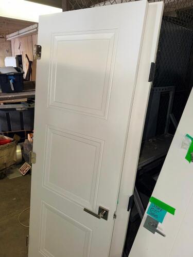 NEW WHITE INTERIOR DOOR W/ HARDWARE.