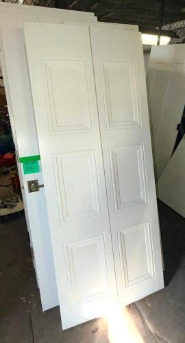 (2) NEW WHITE INTERIOR FOLDING PANEL DOORS.