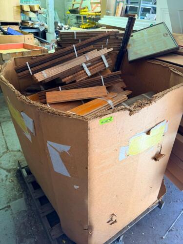 LOT OF RECLAIMED HARDWOOD FLOORING, MOLDING, AND MILLWORK PIECES. LOT INCLUDES ASSORTED LENGTHS OF DECORATIVE TRIM, BASEBOARD, CASING, AND OTHER FINISHED WOOD MOLDING WITH VARIOUS PROFILES AND FINISHES.