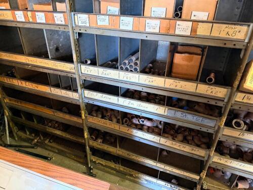 CONTENTS OF METAL ORGANIZER BIN SYSTEM - ASSORTED PIPE FITTING, ELBOWS, AND SECTIONS.