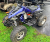 12024 250CC SPORT ATV WITH FRONT AND REAR CARGO RACKS, FRONT AND REAR SUSPENSION, FRONT BUMPER, ELECTRIC START, AUTOMATIC TRANSMISSION WITH REVERSE, AND KNOBBY OFF-ROAD TIRES.