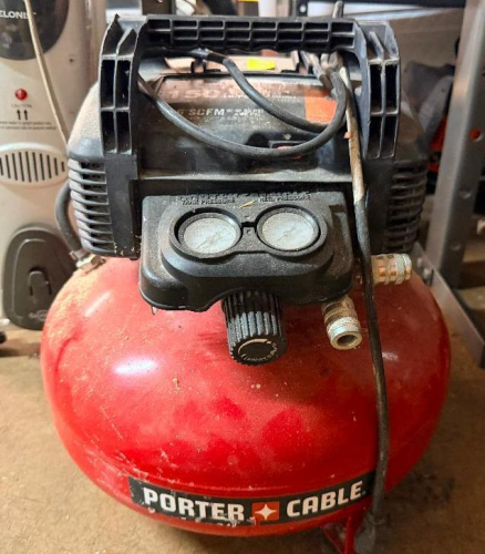 PORTABLE 6-GALLON OIL-FREE PANCAKE AIR COMPRESSOR WITH DUAL AIR OUTLETS, REGULATOR, DUAL PRESSURE GAUGES, CARRY HANDLE, AND POWER CORD.