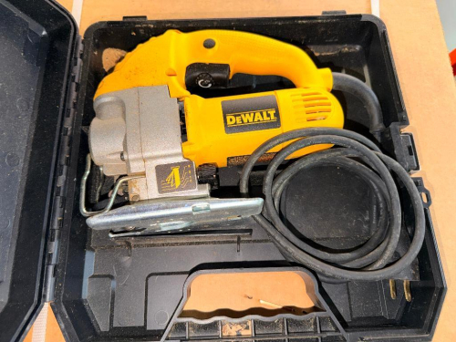 ELECTRIC ORBITAL JIG SAW WITH VARIABLE SPEED CONTROL, ADJUSTABLE BEVEL SHOE, AND MOLDED CARRYING CASE. INCLUDES POWER CORD AND CASE