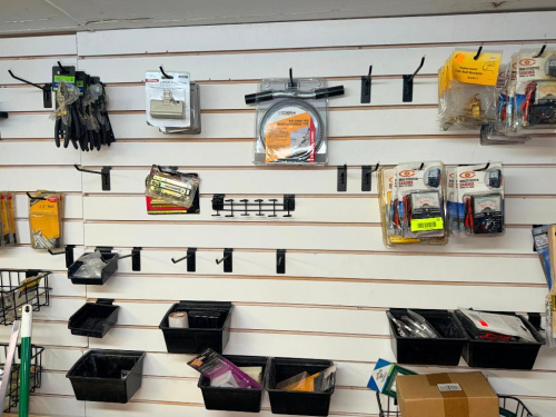CONTENTS OF PEG BOARD - ASSORTED TOOLING AND HARDWARE.