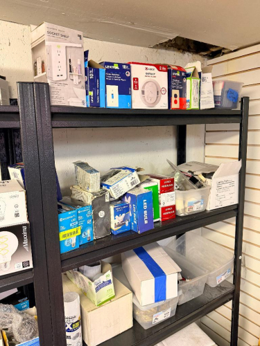 CONTENTS OF SHELF - ASSORTED LIGHTING FIXTURES AND HARDWARE.