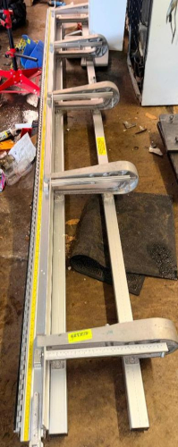 HEAVY-DUTY PANEL CLAMPING AND STRAIGHT EDGE SYSTEM WITH FOUR ADJUSTABLE CLAMP ARMS, EXTRUDED ALUMINUM RAIL, AND PRECISION GUIDE SCALE.