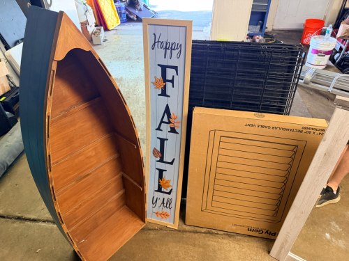 DOG CRATE, DECORATIVE BOAT, AND FALL SIGN