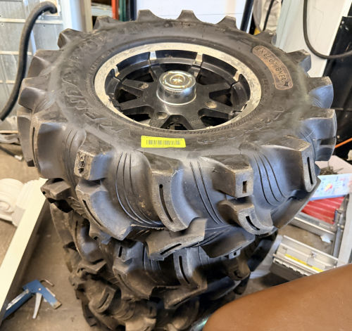 SET OF (4) KENDA EXECUTIONER ATV TIRES MOUNTED ON ALUMINUM WHEELS.