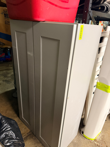 25" TWO DOOR KITCHEN TOP CABINET.