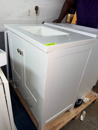 24" WHITE SINGLE-SINK BATHROOM VANITY WITH INTEGRATED SOLID SURFACE TOP.