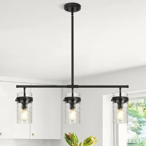 SEDONA 3-LIGHT PENDANT LUMINAIRE WITH MATTE BLACK FINISH AND CLEAR GLASS SHADES.