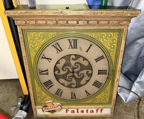 VINTAGE FALSTAFF LIGHTED PLASTIC ADVERTISING WALL CLOCK WITH ROMAN NUMERAL DIAL.