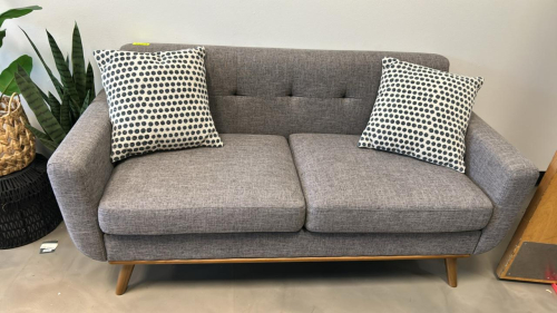 (1) GRAY COUCH WITH (2) WHITE AND GRAY PILLOWS