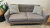 (1) GRAY COUCH WITH (2) WHITE AND GRAY PILLOWS
