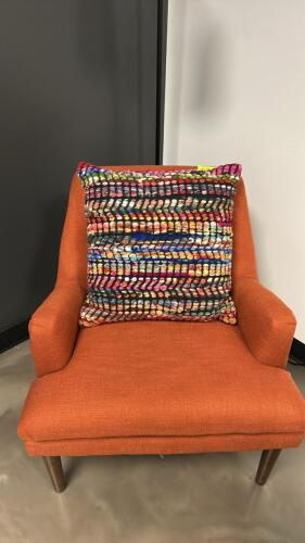 (1) ORANGE OFFICE CHAIR (1) MULTI COLORED PILLOW