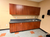 MODULAR BREAKROOM CABINETRY SET WITH LAMINATE COUNTERTOP, DOUBLE-BASIN STAINLESS STEEL SINK, GOOSENECK FAUCET, UPPER WALL CABINETS, BASE CABINETS, DRAWERS, AND INTEGRATED BACKSPLASH - 2